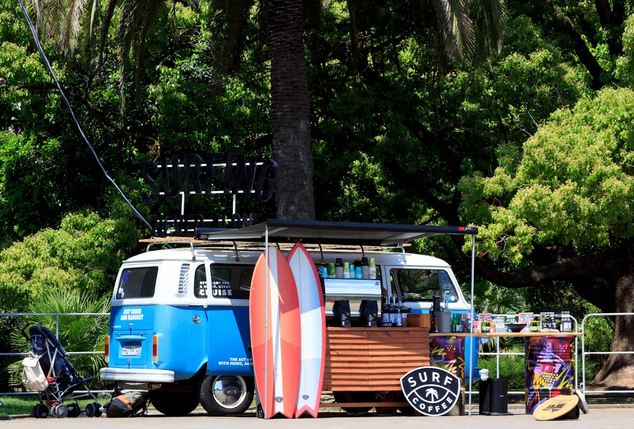 camper van surf cafe under some trees